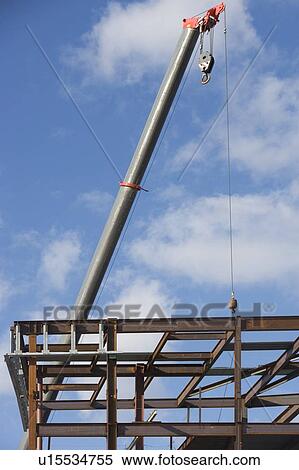 Stock Photography - Part of construction frame and crane. Fotosearch