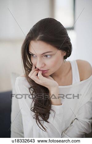 Stock Image - Pensive woman . Fotosearch