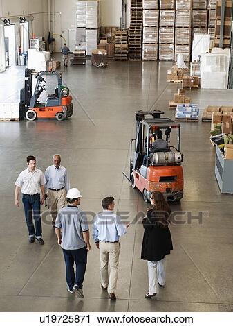 People working in warehouse View Large Photo Image Stock Image - People working in warehouse. Fotosearch