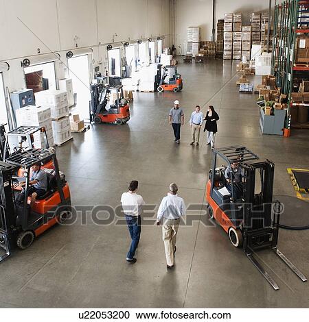 People working in warehouse View Large Photo Image Stock Image - People working in warehouse. Fotosearch