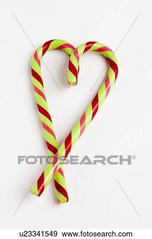 Peppermint candy canes in heart shape, studio shot View Large Photo Image Stock Photo - Peppermint candy canes in heart shape, studio shot. Fotosearch