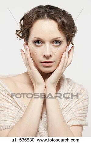 Portrait of beautiful young woman, studio shot View Large Photo Image Stock Image - Portrait of beautiful young woman, studio shot. Fotosearch