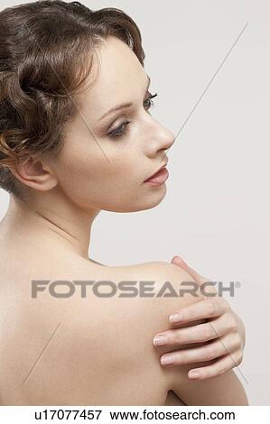 Portrait of beautiful young woman, studio shot View Large Photo Image Stock Photo - Portrait of beautiful young woman, studio shot. Fotosearch