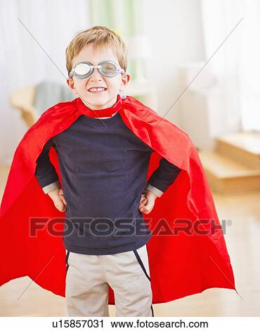 Portrait of boy (6-7) wearing superhero costume View Large Photo Image Stock Image - Portrait of boy (6-7) wearing superhero costume. Fotosearch