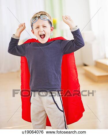 Portrait of boy (6-7) wearing superhero costume View Large Photo Image Stock Photograph - Portrait of boy (6-7) wearing superhero costume. Fotosearch