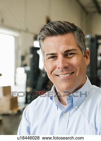 Portrait of businessman in warehouse View Large Photo Image Stock Photo - Portrait of businessman in warehouse. Fotosearch