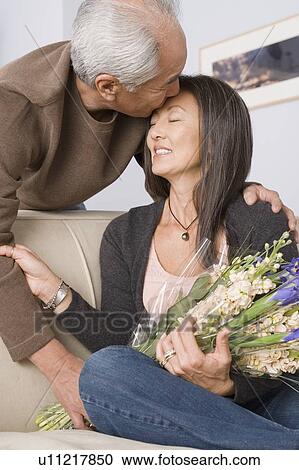 Stock Image - Portrait of couple embracing. Fotosearch