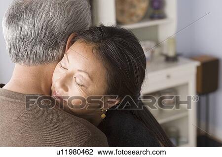 Portrait of couple embracing View Large Photo Image Stock Image - Portrait of couple embracing. Fotosearch