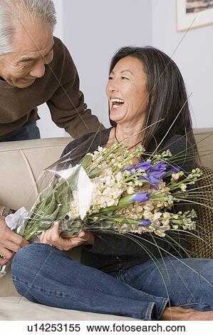Stock Photography - Portrait of couple embracing. Fotosearch