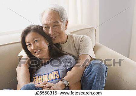 Stock Photography - Portrait of couple embracing. Fotosearch