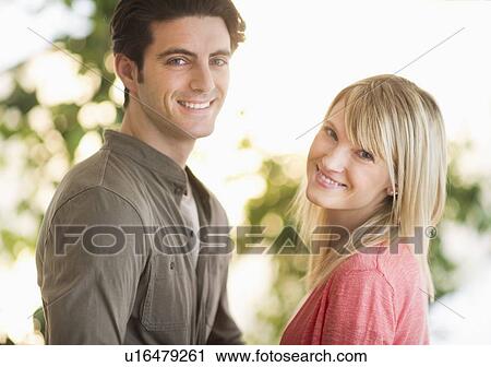 Portrait of couple in park View Large Photo Image Stock Image - Portrait of couple in park. Fotosearch