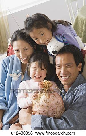Portrait of family with two daughters (10-11) View Large Photo Image Stock Photo - Portrait of family with two daughters (10-11). Fotosearch