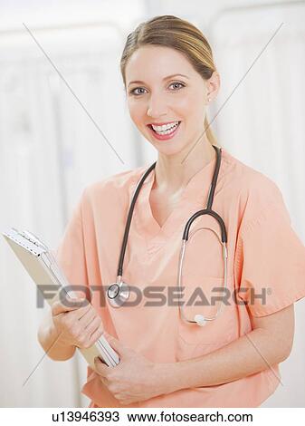 Stock Image - Portrait of female doctor. Fotosearch