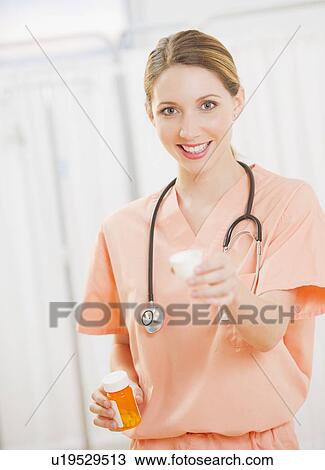 Stock Image - Portrait of female doctor. Fotosearch