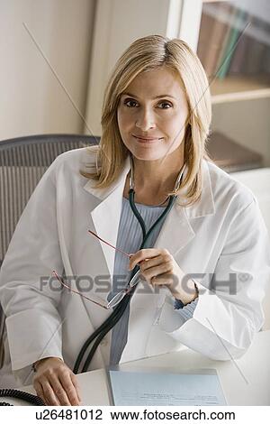 Stock Image - Portrait of female doctor. Fotosearch