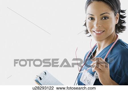 Stock Image - Portrait of female doctor. Fotosearch