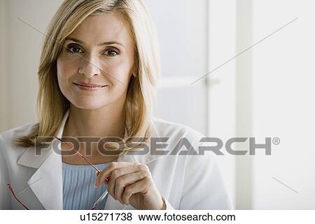 Stock Photo - Portrait of female doctor. Fotosearch