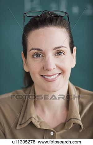Stock Photo - Portrait of female teacher. Fotosearch