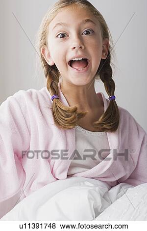 Portrait of girl making funny face View Large Photo Image Stock Photo - Portrait of girl making funny face. Fotosearch