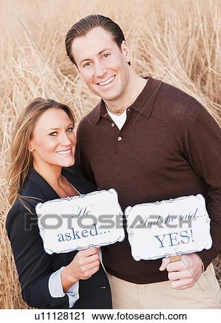 Portrait of happy young couple on wheat field View Large Photo Image Stock Image - Portrait of happy young couple on wheat field. Fotosearch