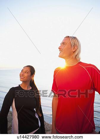 Portrait of male and female joggers at sea View Large Photo Image Stock Image - Portrait of male and female joggers at sea. Fotosearch