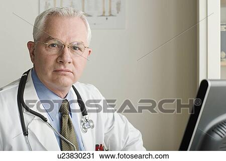 Portrait of male doctor View Large Photo Image Stock Image - Portrait of male doctor. Fotosearch