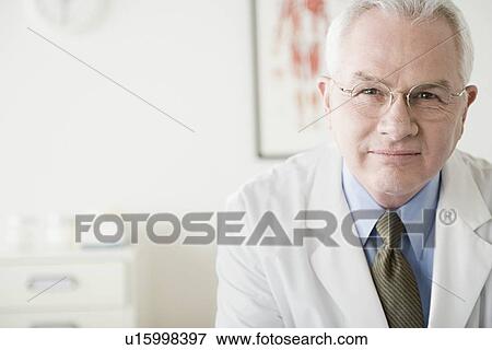 Portrait of male doctor View Large Photo Image Stock Photo - Portrait of male doctor. Fotosearch