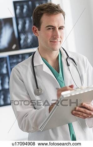 Portrait of male doctor View Large Photo Image Stock Photo - Portrait of male doctor. Fotosearch