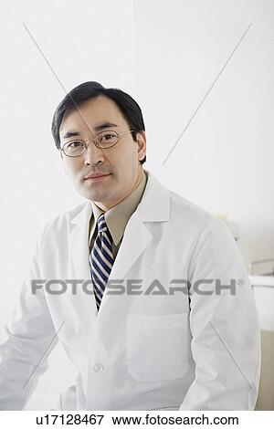 Portrait of male doctor View Large Photo Image Stock Photo - Portrait of male doctor. Fotosearch