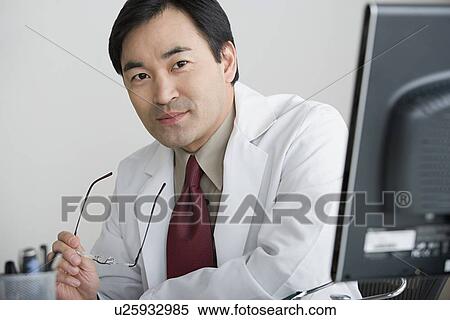 Stock Photography - Portrait of male doctor. Fotosearch