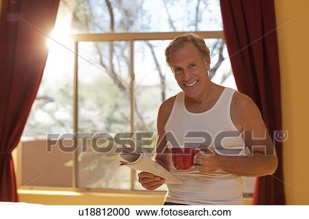 Portrait of man in bedroom View Large Photo Image Stock Image - Portrait of man in bedroom. Fotosearch