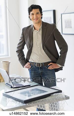 Stock Image - Portrait of man in his art gallery. Fotosearch