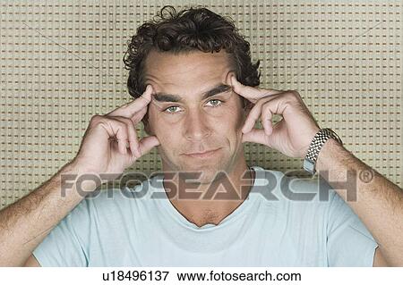 Portrait of man pulling face View Large Photo Image Stock Photo - Portrait of man pulling face. Fotosearch