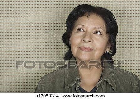 Picture - Portrait of older woman lost in thoughts. Fotosearch