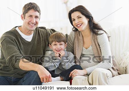 Portrait of parents with son (4-5) on sofa View Large Photo Image Stock Image - Portrait of parents with son (4-5) on sofa. Fotosearch