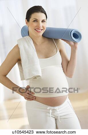 Portrait of pregnant woman exercising View Large Photo Image Stock Image - Portrait of pregnant woman exercising. Fotosearch
