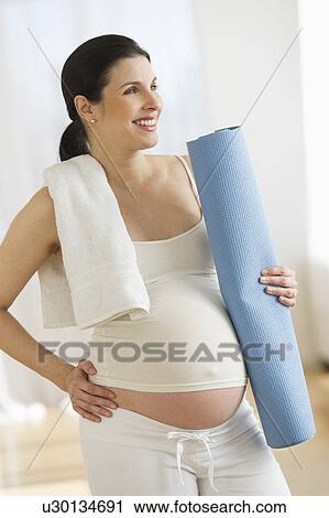 Portrait of pregnant woman exercising View Large Photo Image Stock Image - Portrait of pregnant woman exercising. Fotosearch