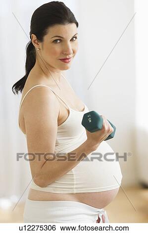 Portrait of pregnant woman exercising View Large Photo Image Stock Photograph - Portrait of pregnant woman exercising. Fotosearch