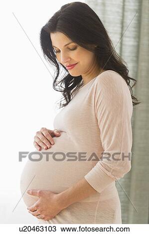 Stock Image - Portrait of pregnant woman. Fotosearch