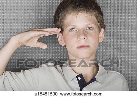 Stock Image - Portrait of saluting boy. Fotosearch