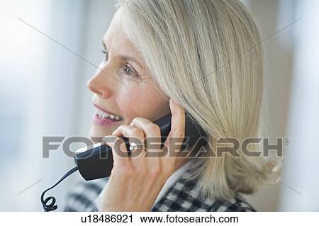 Portrait of senior businesswoman talking on phone View Large Photo Image Stock Image - Portrait of senior businesswoman talking on phone. Fotosearch