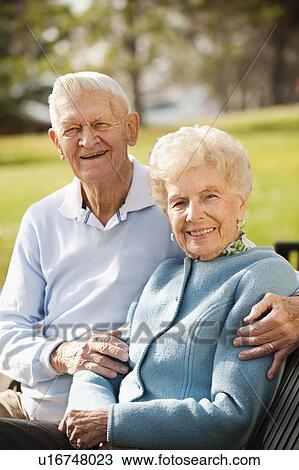 Portrait of senior couple on park bench View Large Photo Image Stock Image - Portrait of senior couple on park bench. Fotosearch