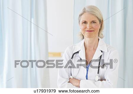 Portrait of senior female doctor in her office View Large Photo Image Stock Photo - Portrait of senior female doctor in her office. Fotosearch