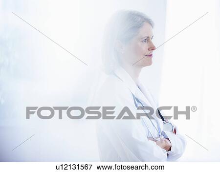 Portrait of senior female doctor View Large Photo Image Stock Photo - Portrait of senior female doctor . Fotosearch