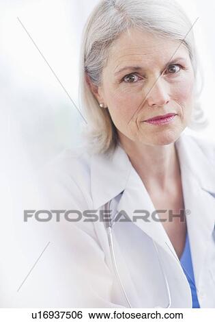 Stock Photograph - Portrait of senior female doctor . Fotosearch