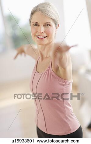 Portrait of senior woman exercising in gym View Large Photo Image Stock Image - Portrait of senior woman exercising in gym. Fotosearch