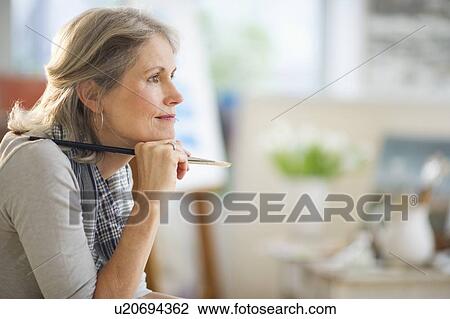 Portrait of senior woman in art studio View Large Photo Image Stock Image - Portrait of senior woman in art studio. Fotosearch