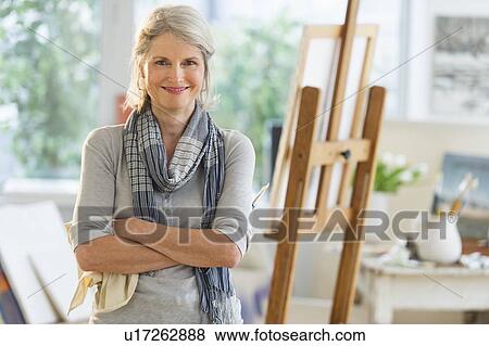 Stock Photo - Portrait of senior woman in art studio. Fotosearch