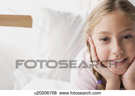 Stock Photo - Portrait of smiling girl (12-13) . Fotosearch