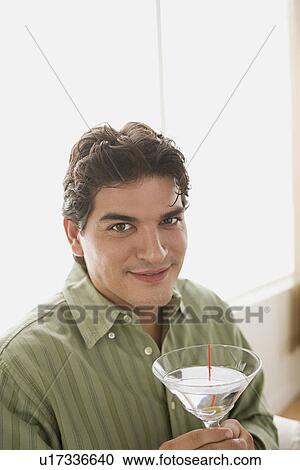 Portrait of smiling man having cocktail View Large Photo Image Stock Image - Portrait of smiling man having cocktail. Fotosearch
